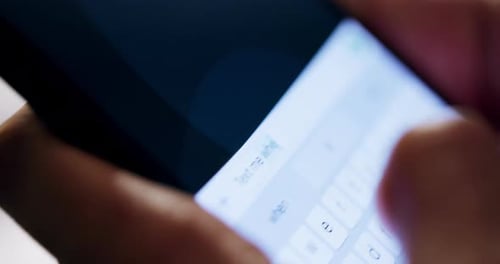 Typing a Text Message on a Smart Phone