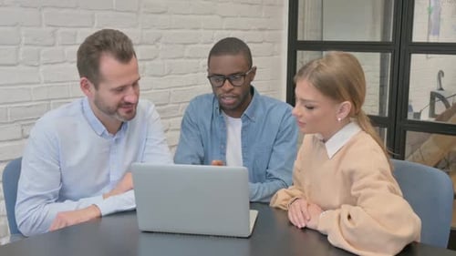 Multi Ethnic People Working on Laptop in Office
