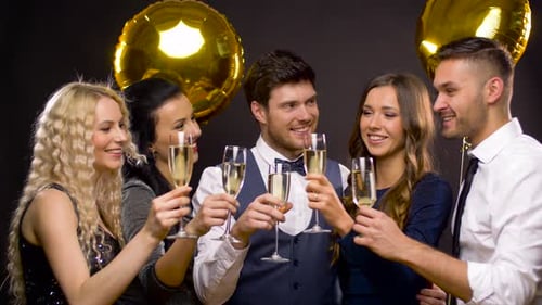Friends Celebrating with Champagne at Elegant Party