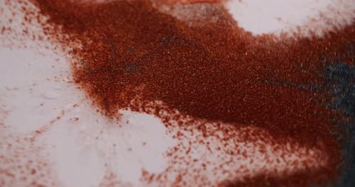 Copper Pigment Being Stirred in White Liquid