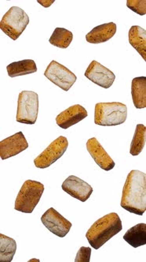 Seamless Loop of Baked Goods Falling on White Background