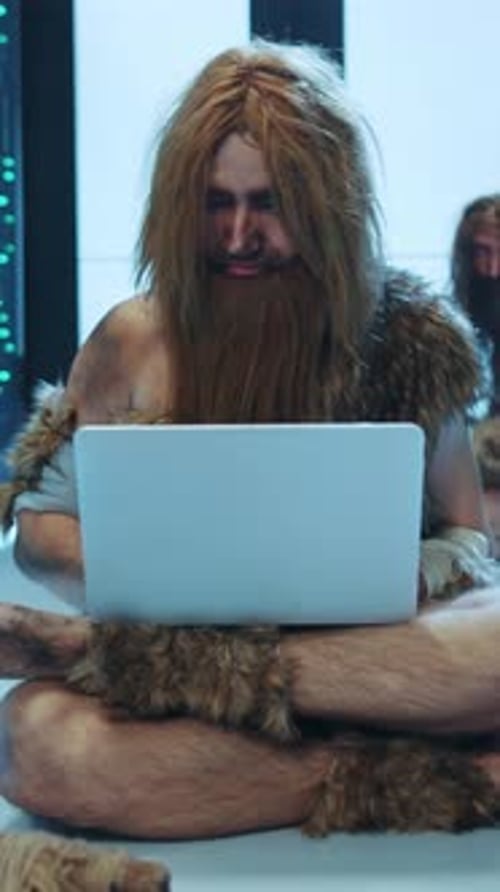 A Caveman Humorously Interacting with Modern Technology in a Funny and Creative Setting