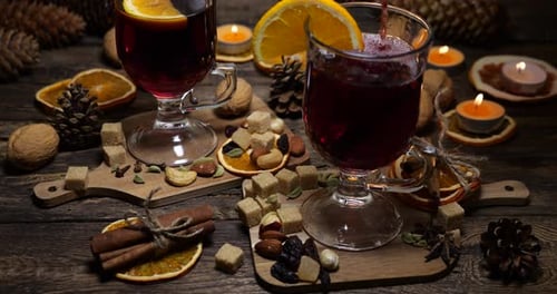 Pouring Mulled Wine with Festive Holiday Ingredients