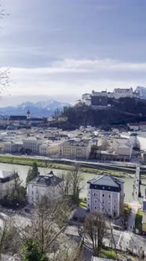 Salzburg Fortress perched above Salzburg city with mountains in background