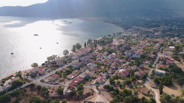 Aerial of Sami, Kefalonia, Greece, coastal town with blue sea and green ...