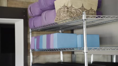 Yoga Equipment and Props on Metal Rack