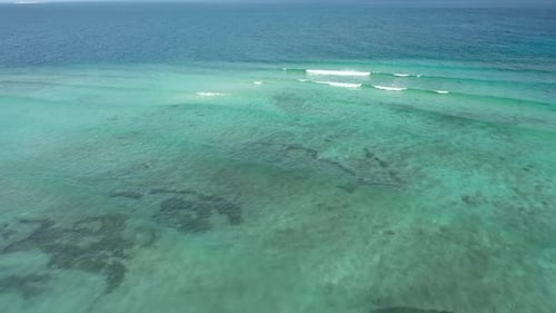 Drone photo of waves. The Maldives on a sunny day