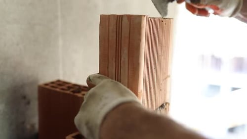 Laying Red Bricks With Cement Material