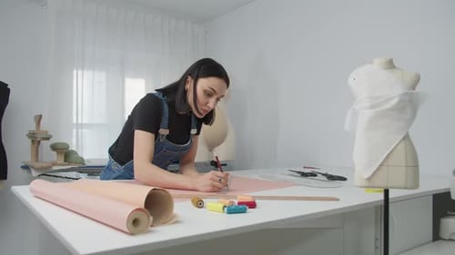 Woman Designs Pattern in Studio