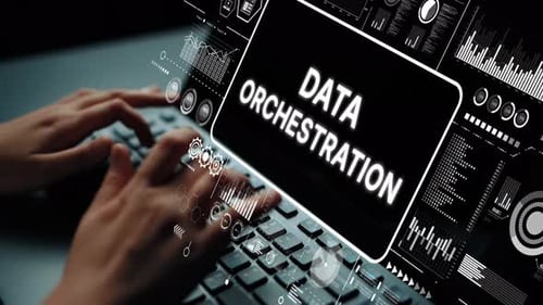 Hands Typing on Keyboard with Data Orchestration Graphic Overlay in Modern Digital Workspace. Asympt