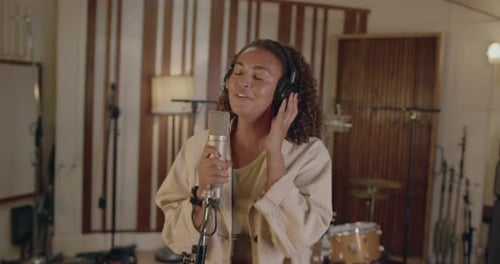 Female Singer Performing in Music Studio