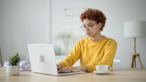Young Woman Sits in Home Office at Workplace and Engaged Online Freelance Work