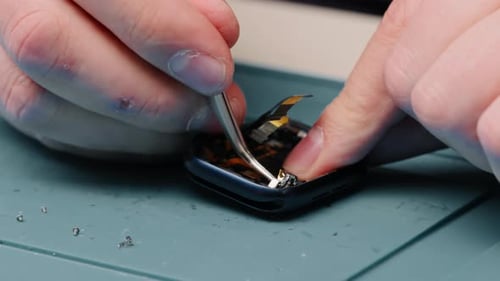 smart watch being repaired by an engineer Workshop for the repair of phones and equipment
