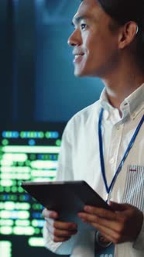 Vertical Video Developer Strolling Through Data Center