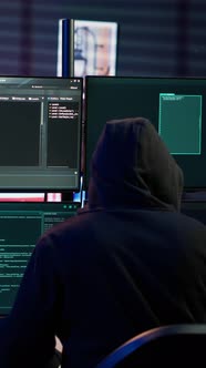 Vertical Video Close Up of Hacker Running Code in Apartment on PC ...