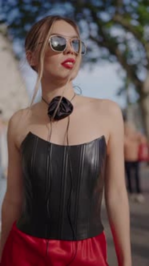 Stylish Woman in Corset Walks City Street