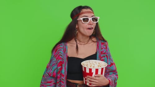 Enthusiastic Woman Holding Popcorn Reacting to Movie