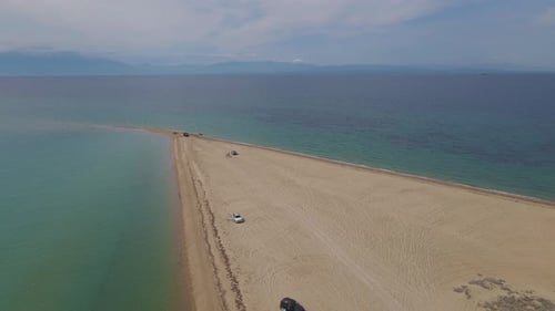 4k steady clip over a peninsula on the tropical beach of Epanomi, Halkidiki, Greece