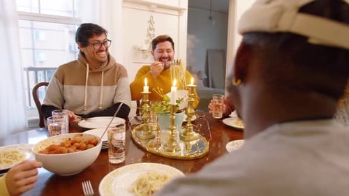 Group of Friends Enjoying Meal Together Indoors
