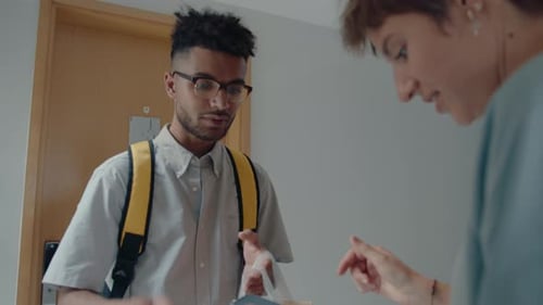 Woman Receiving Food Order from Delivery Guy