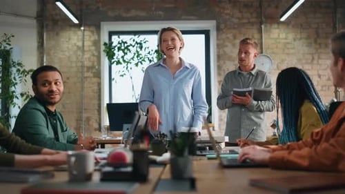 Smiling Coach Talking Coworkers at Office Meeting Happy Team Discussing Ideas