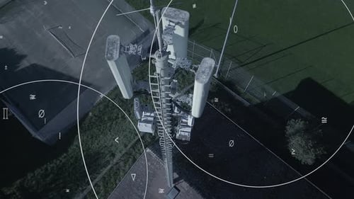 An Aerial Perspective of Telecommunications Tower Standing Amidst Expansive Fields and Surroundings