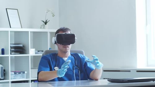 Professional Medical Doctor Working in Hospital Office Using Virtual Reality Technology