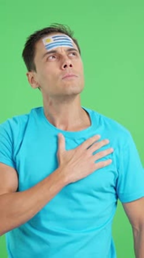 Man Listening to the Uruguay National Anthem with Solemnity