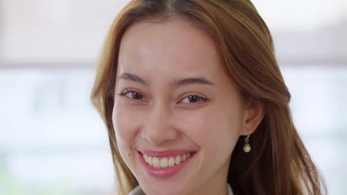 Smiling Young Woman Close Up Portrait Indoors