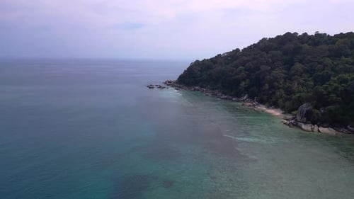 untoucht beach at granite rocks island, turquoise water. Dramatic aerial view flight drone