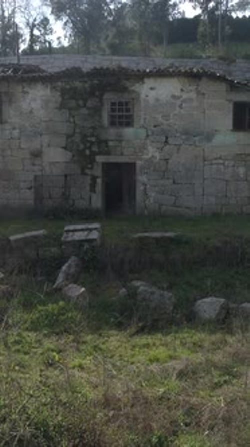 Fly above abandoned houses vertical video