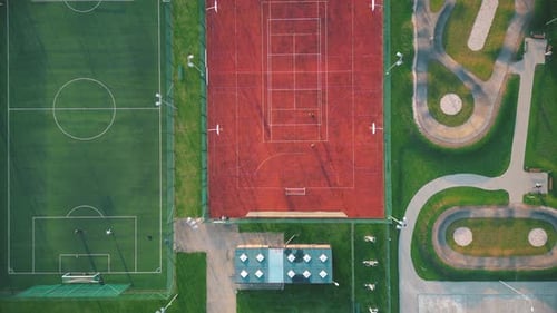 Recreational green grass active sports hockey and football fields overhead top down view. Competitio