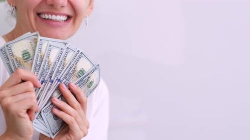 Excited Smiling Woman Showing Cash Money 1000 American Dollars Banknotes Hands with Money Close Up