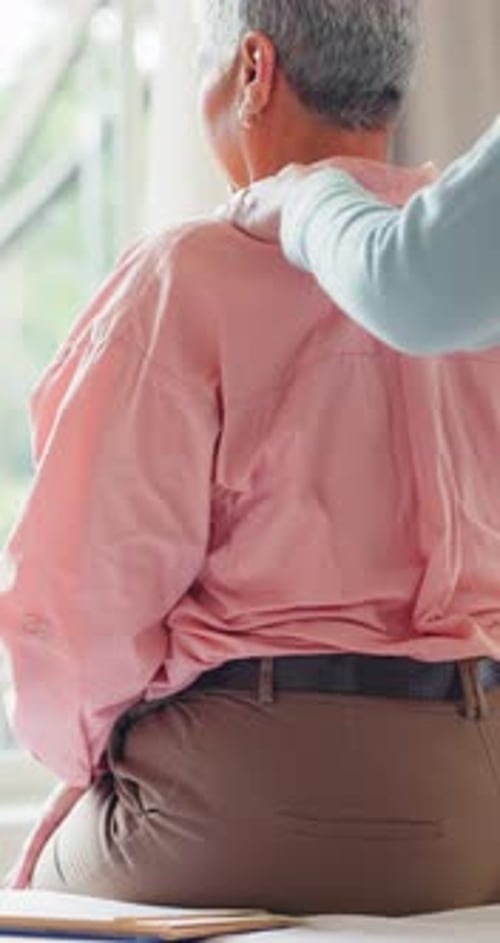 Clinic, senior woman and chiropractor with back pain, healing, conversation and rehabilitation