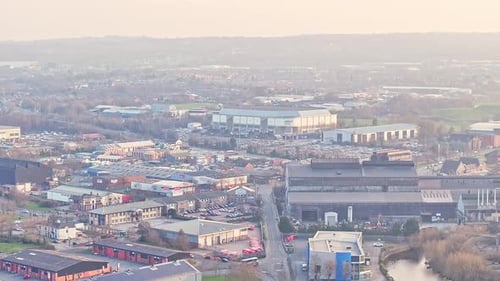 High drone descend of shopping area and surrounding infrastructure