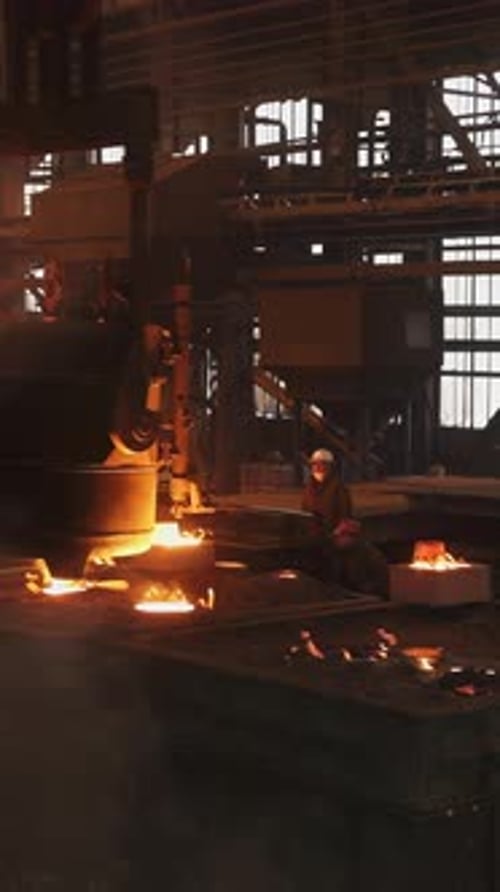 Molten Metal Pouring Into Mold in Steel Mill Stock Clip
