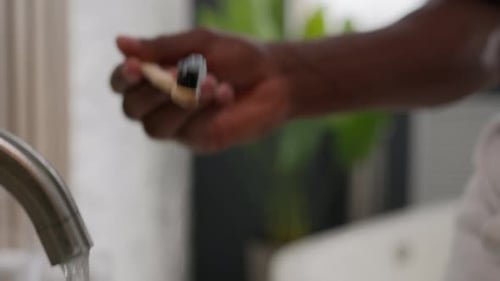 Moving Shot African American Male Hold Toothbrush with Whitening Toothpaste Ethnic Man Brushing