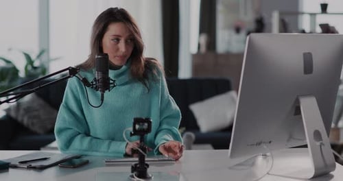 A Modern Content Creator Enthusiast Working in a Cozy and Inviting Studio Setting