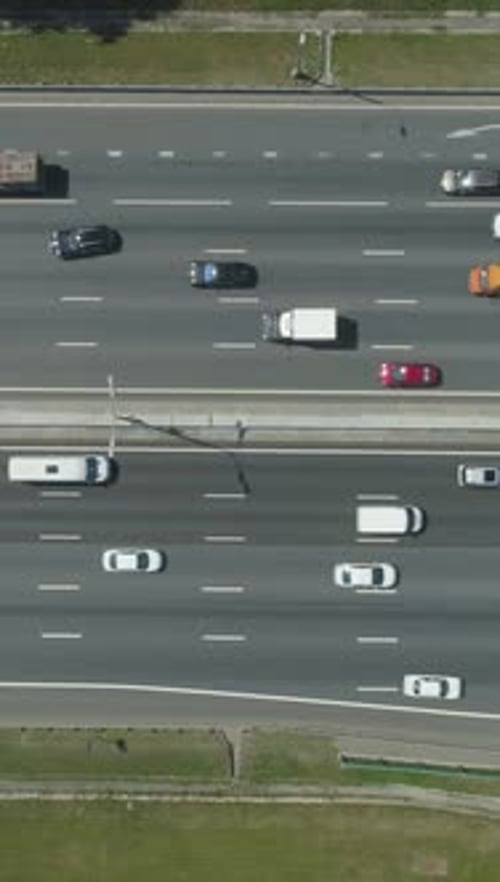 Cars on Highway in City in Sunny Summer Day Aerial Vertical TopDown View Vertical Video