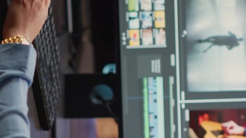 Woman Editing Video with Keyboard and Mouse