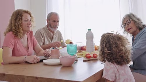 Multi-Generational Family Enjoying Meal Together at Home