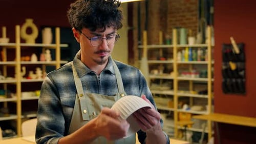 Caucasian Man Potter Holding Bowl Handmade Pottery Stoneware Product Porcelain Handcraft in Workshop