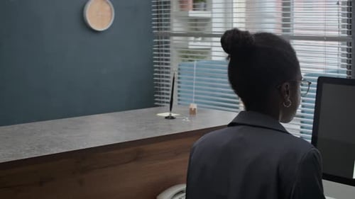 Female Manager Giving Questionnaire to Male Client Visiting Bank Office