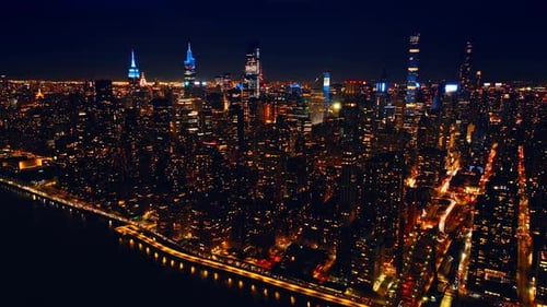Manhattan panorama with amazing illumination. Night scenery of New York, USA at night.