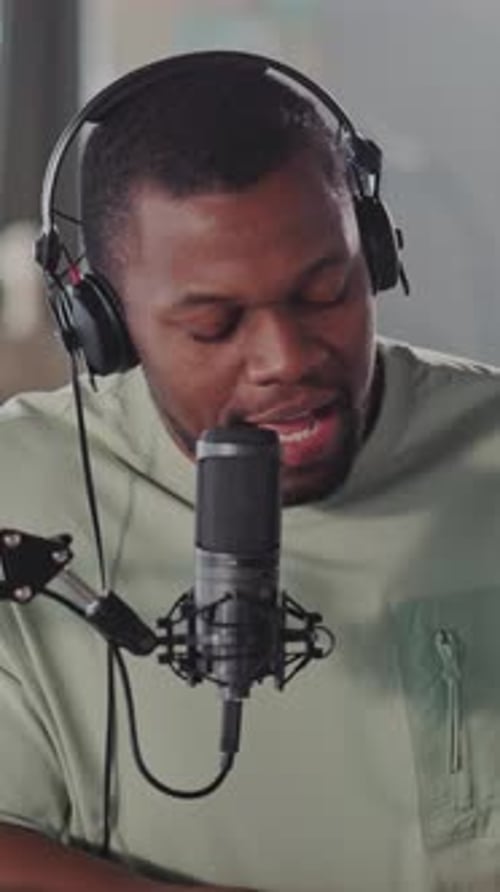 Man Speaking into Microphone in Vertical Video