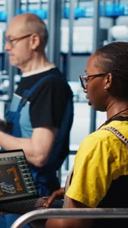 Vertical Video Engineers Talking with Manager Overseeing Smart Photovoltaics Factory