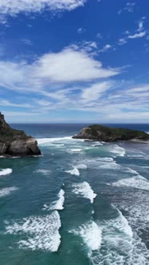 An Aerial View of the Coastal Rock Formations That Beautifully Line the Coastline Vertical Video