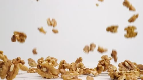 Peeled Walnuts Falling in Slow Motion