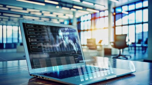 Laptop Showing Stock Market Data with Digital Overlay in Modern Office Setting
