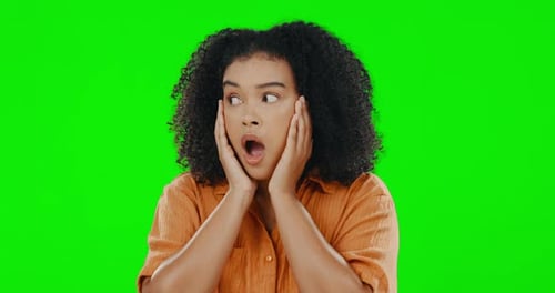 Face, wow and portrait of woman on a green screen with hands on face